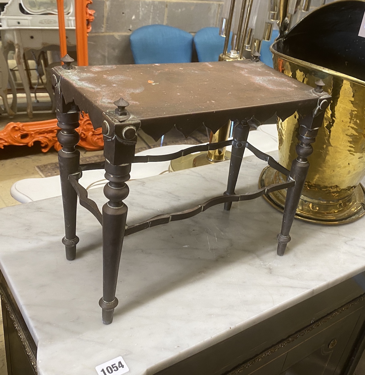 A 19th century Dutch embossed brass coal scuttle with swing handle together with a Victorian copper trivet